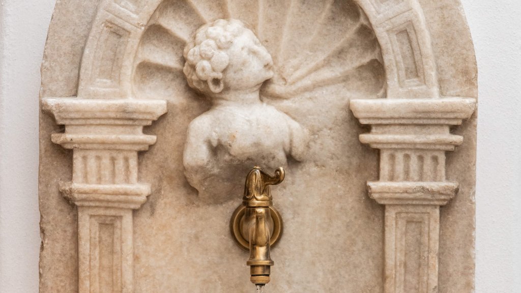 The perfect location for your apartment in Sterzing Antique water tap with marble cherub bust mounted on wall